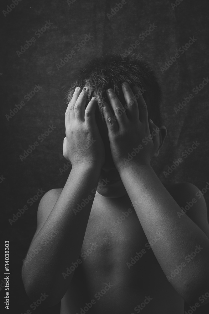 scared and alone, young Asian child who is at high risk of being bullied, trafficked and abused, selective focus scared and alone, young Asian child who is at high risk of being bullied, trafficked and abused, selective focus