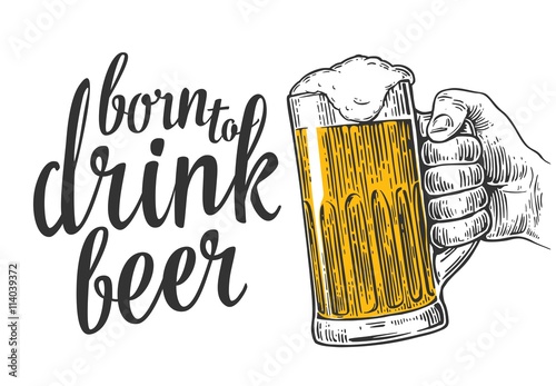 Male hand holding a beer glass.