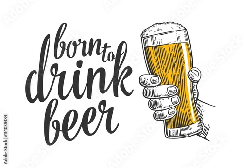 Male hand holding a beer glass.