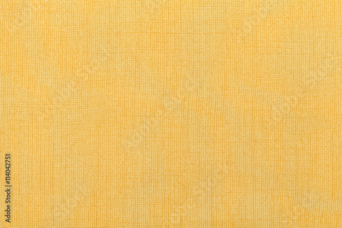 Light yellow ocher background from a textile material. Fabric with natural texture. Backdrop.
