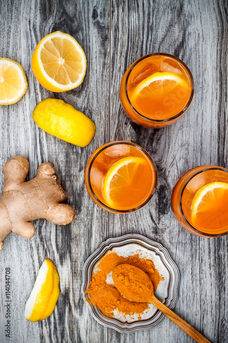 Carrot ginger immune boosting, anti inflammatory lemonade with turmeric and honey. Detox morning juice drink, clean eating