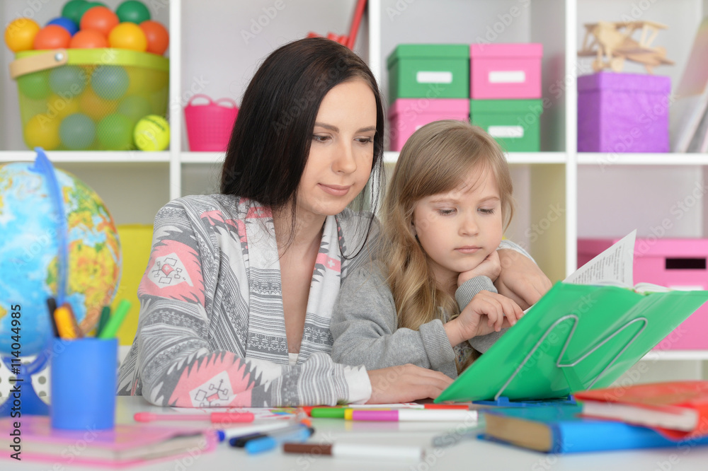 beautiful teacher and little girl beautiful teacher and little girl