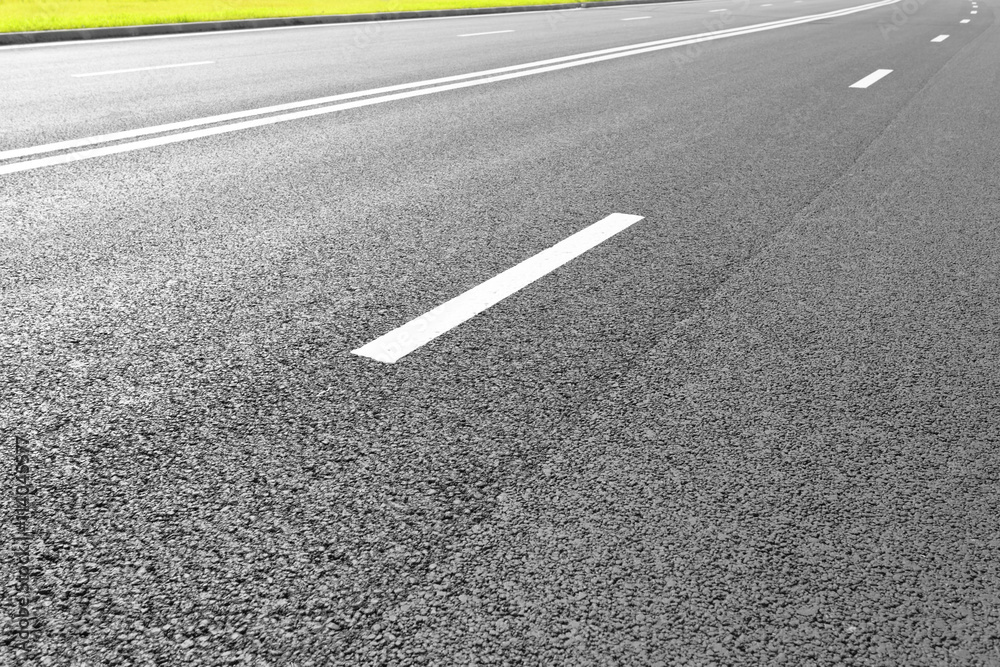 Asphalt road with marking lines white stripes