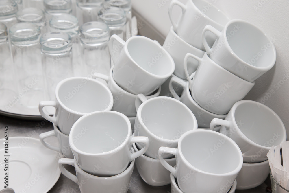 Cups and glasses on a restaurant kitchen. Selective focus. Shall