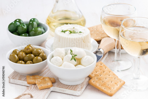 fresh soft cheeses, crackers and pickles to wine