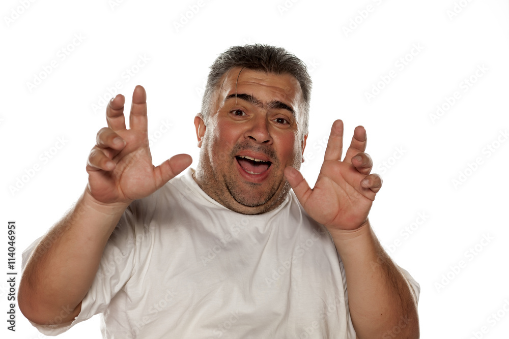 obese frightened man on a white background
