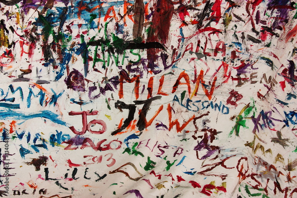 Children names painted in different colours on a white blanket