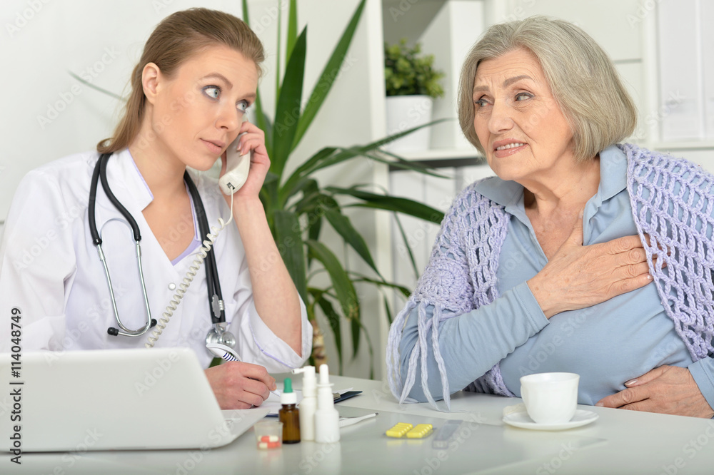 young doctor and her senior senior patient young doctor and her senior senior patient