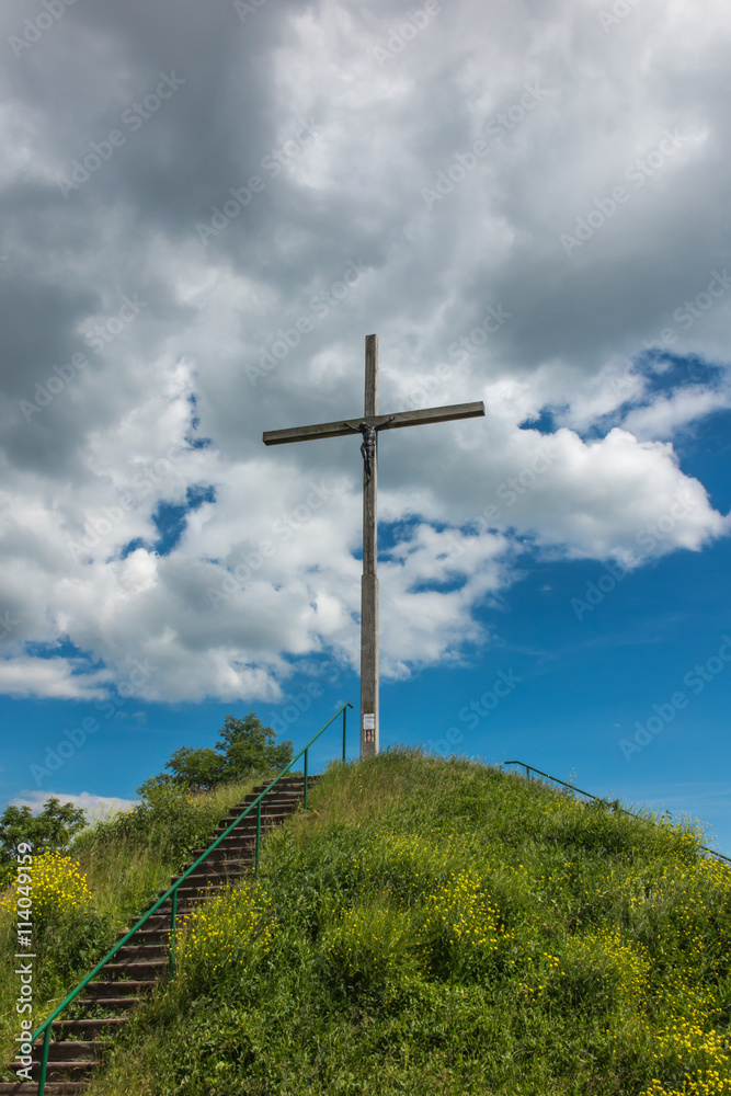wooden cross and partly cloudy sky wooden cross and partly cloudy sky