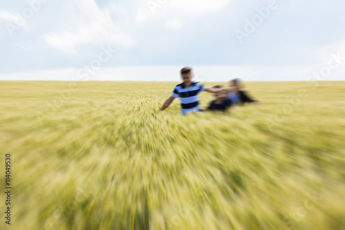 kids on field running blurred.