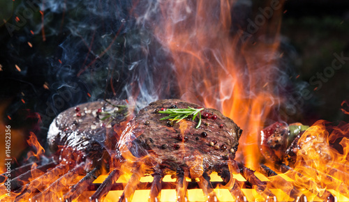 Delicious grilled beef steak on a barbecue grill.
