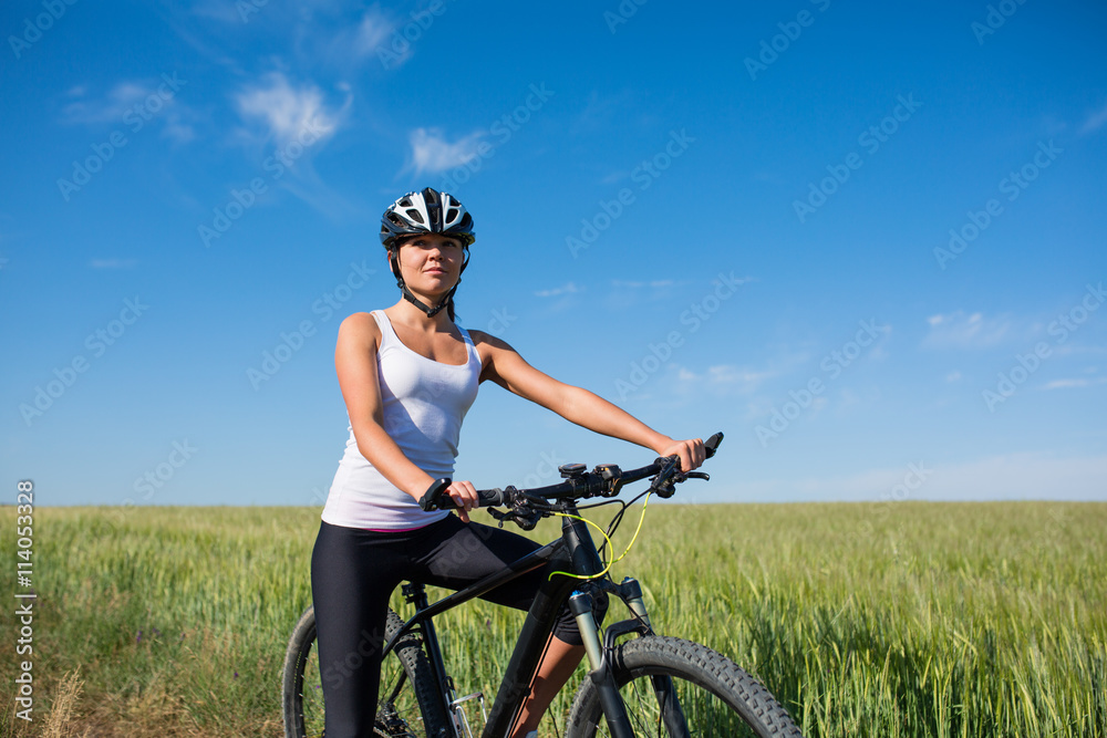 girl rides a bicycle in the countryside girl rides a bicycle in the countryside