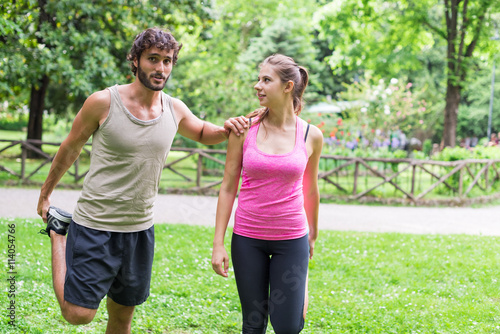 Couple training together in a park