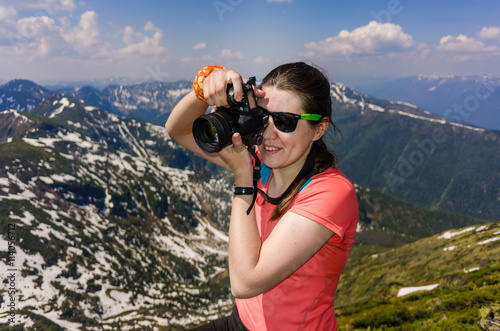 girl tourist on background of mountains