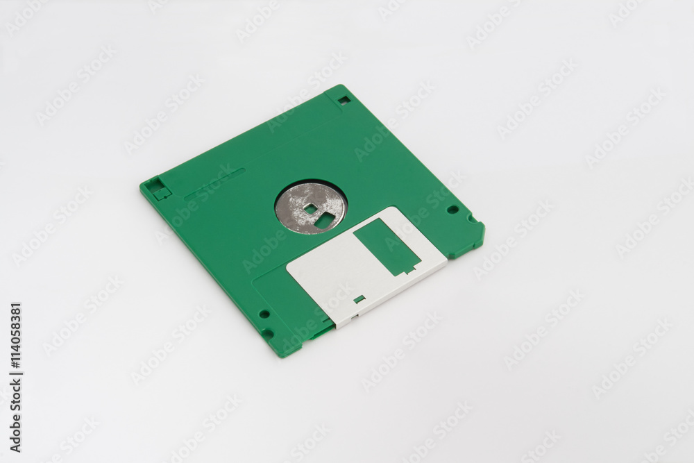 Back side of floppy disk (green color) isolated on white background. Back side of floppy disk (green color) isolated on white background.