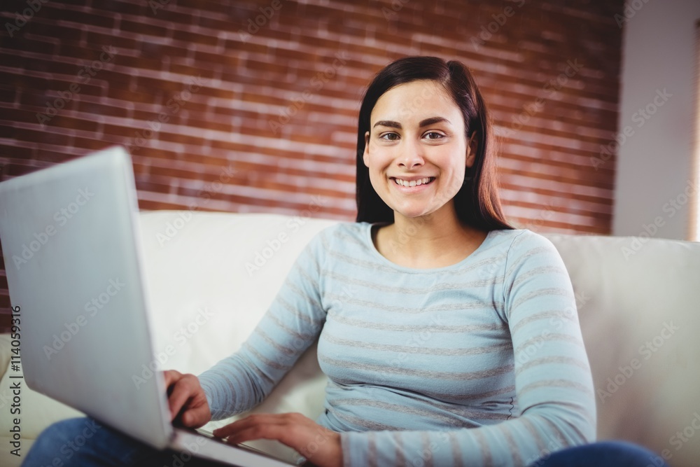 Portrait of smiling woman using laptop Portrait of smiling woman using laptop