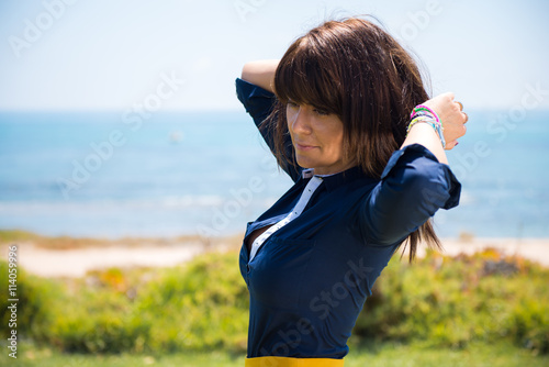 Beautiful woman posing in a park in from the beach