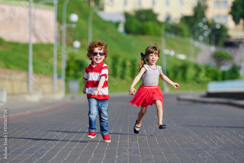happy children running on the promenade