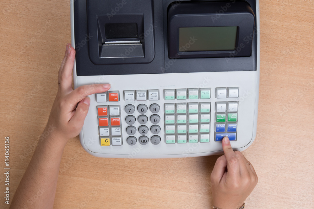 Hand Swiping Credit Card In a Store with cash register Hand Swiping Credit Card In a Store with cash register