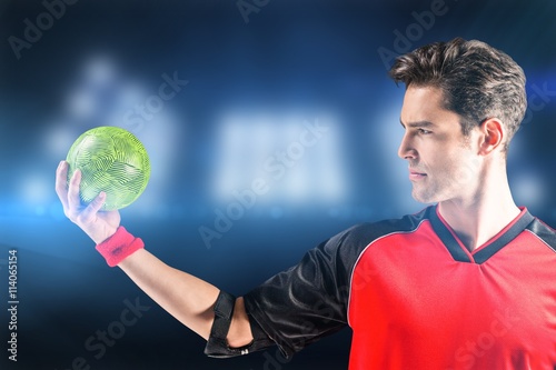 Composite image of confident athlete man holding a ball 