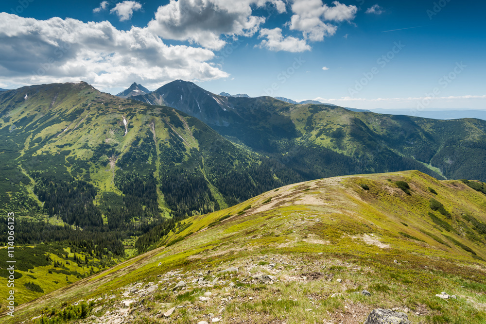 Panoramic vista over high peak mountains