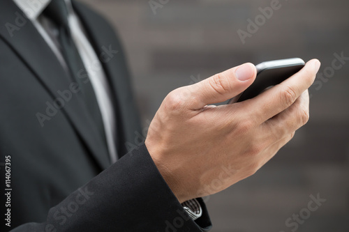 Businessman using mobile smartphone