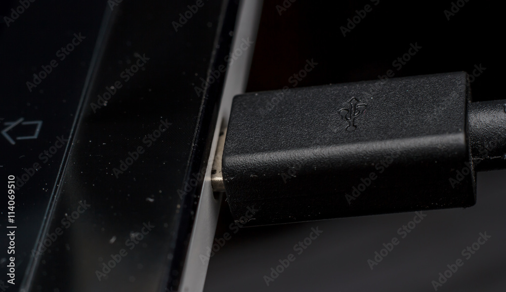 Charging of mobile phone close up