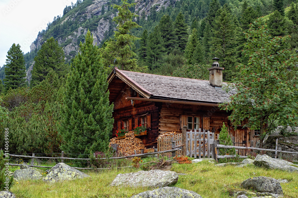 Traditional house at Krimmler Achental (Austria) next to krimml