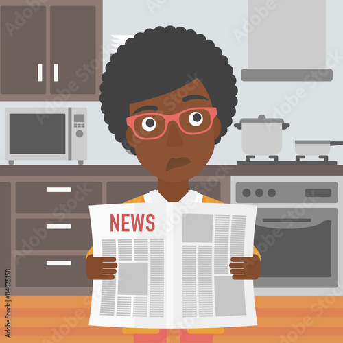 Woman reading newspaper.