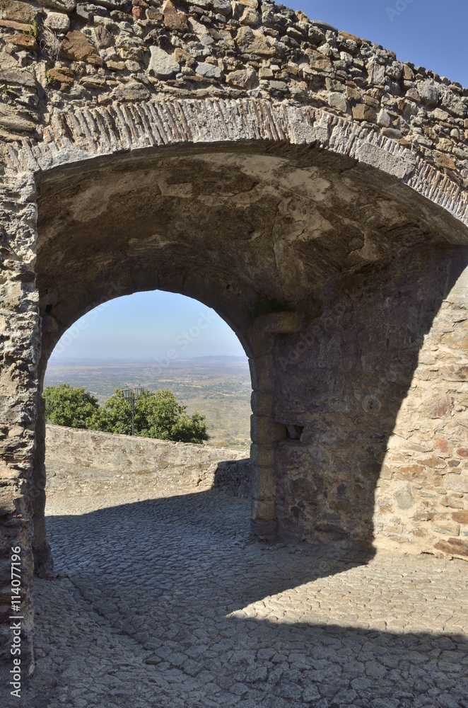 Stone arch to the countryside  in Marvao, Portugal