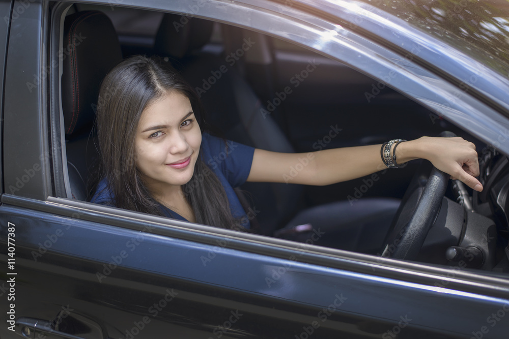 Attractive business woman driving her car Attractive business woman driving her car