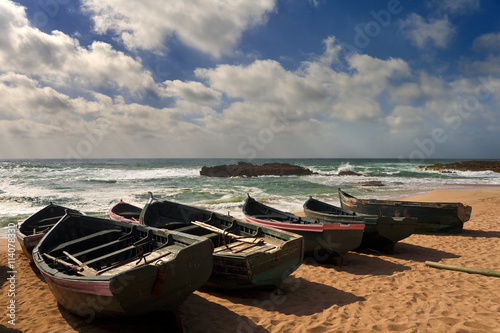 Morocco. Oualidia. Atlantic Coast and fish boats on the beach