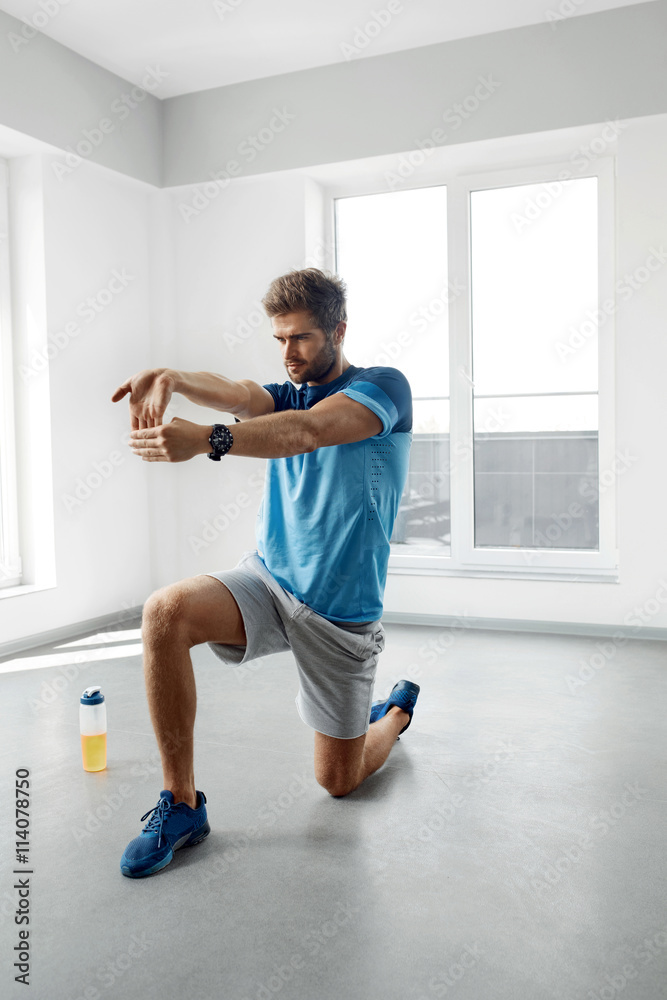Stretch Exercise. Handsome Healthy Man Stretching Before Workout Stretch Exercise. Handsome Healthy Man Stretching Before Workout