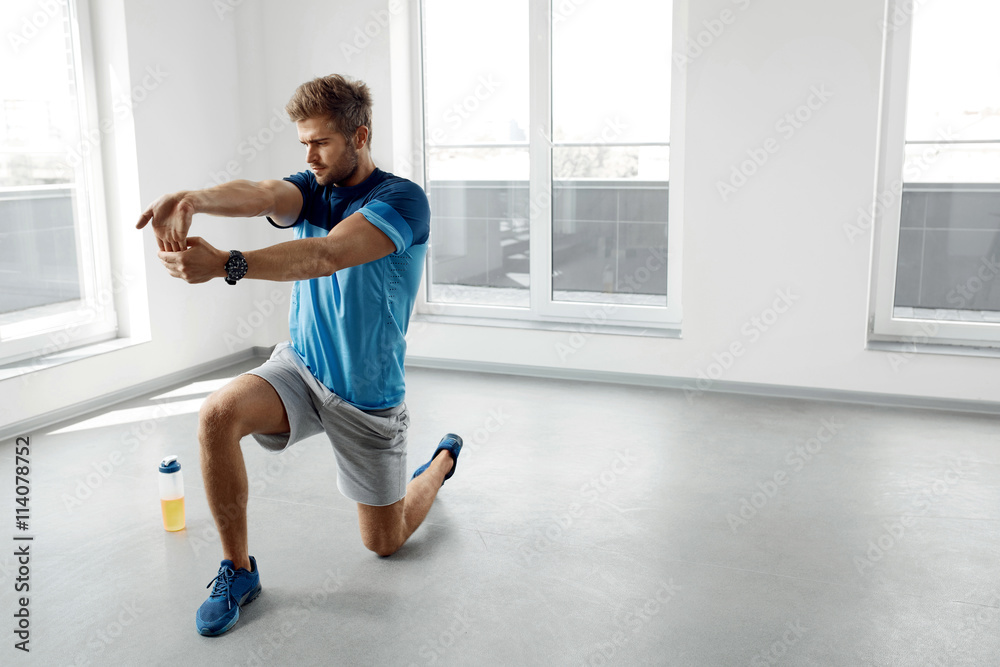 Stretch Exercise. Handsome Healthy Man Stretching Before Workout Stretch Exercise. Handsome Healthy Man Stretching Before Workout
