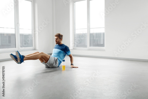 Man Workout Exercises. Fitness Male Model Exercising Indoors