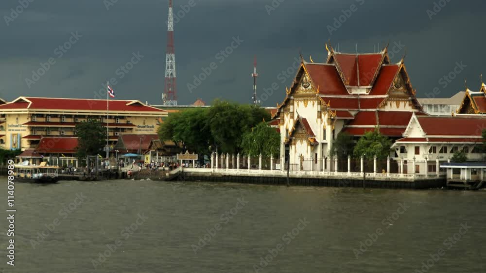 Boat transport near a Buddhist temple on Chao Phraya river in Bangkok Boat transport near a Buddhist temple on Chao Phraya river in Bangkok
