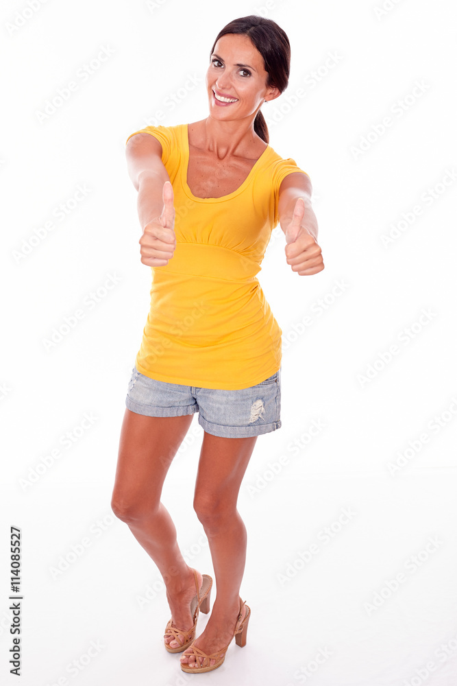 Happy smiling brunette gesturing thumbs up Happy smiling brunette gesturing thumbs up