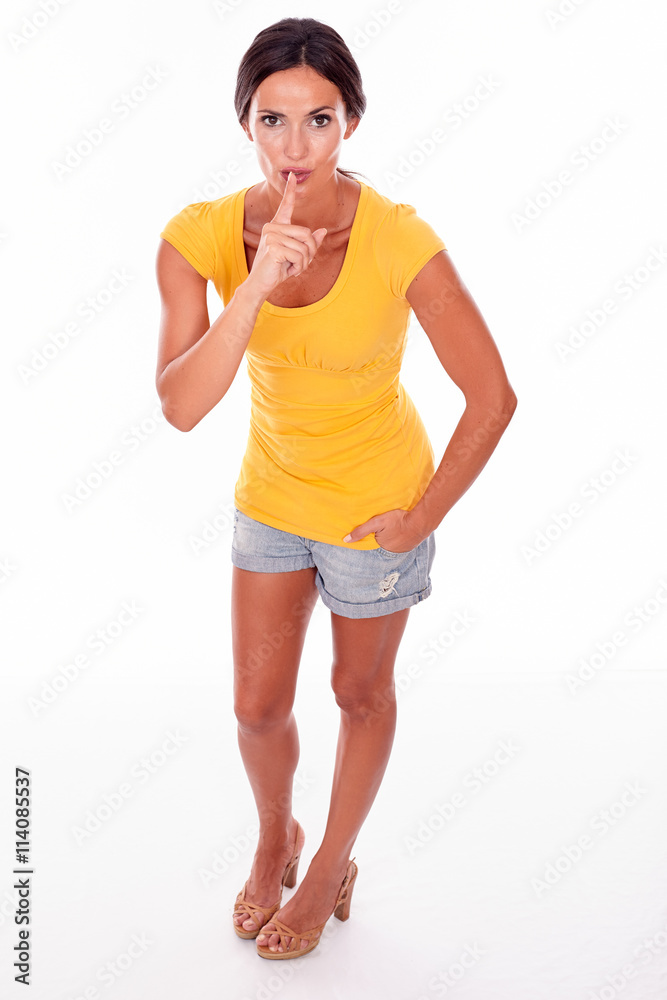 Secretive gesturing don't tell young woman Secretive gesturing don't tell young woman