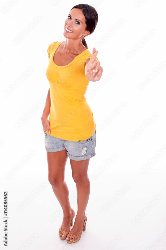Wishing brunette woman with fingers crossed Wishing brunette woman with fingers crossed