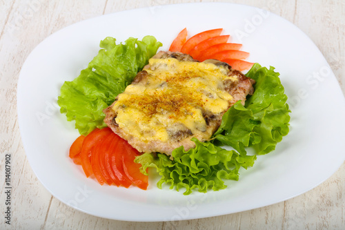 Pork steak with mushroom and cheese