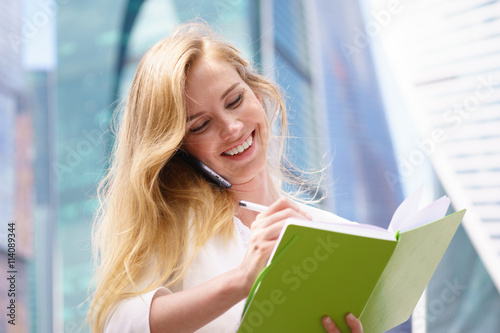 Businesswoman taking notes