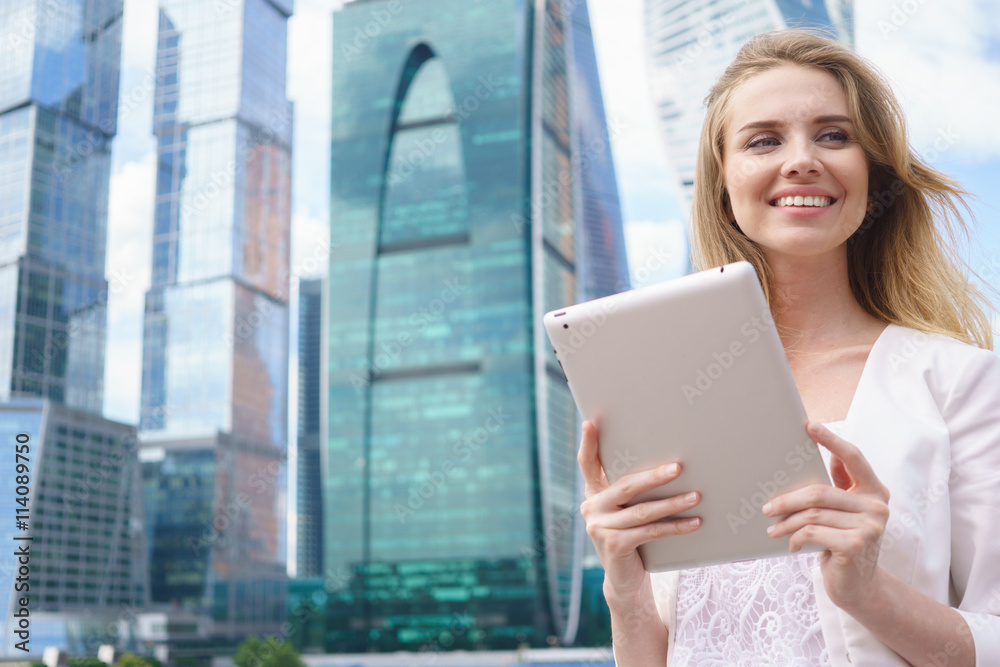Fototapeta premium Young beautiful woman with tablet pc