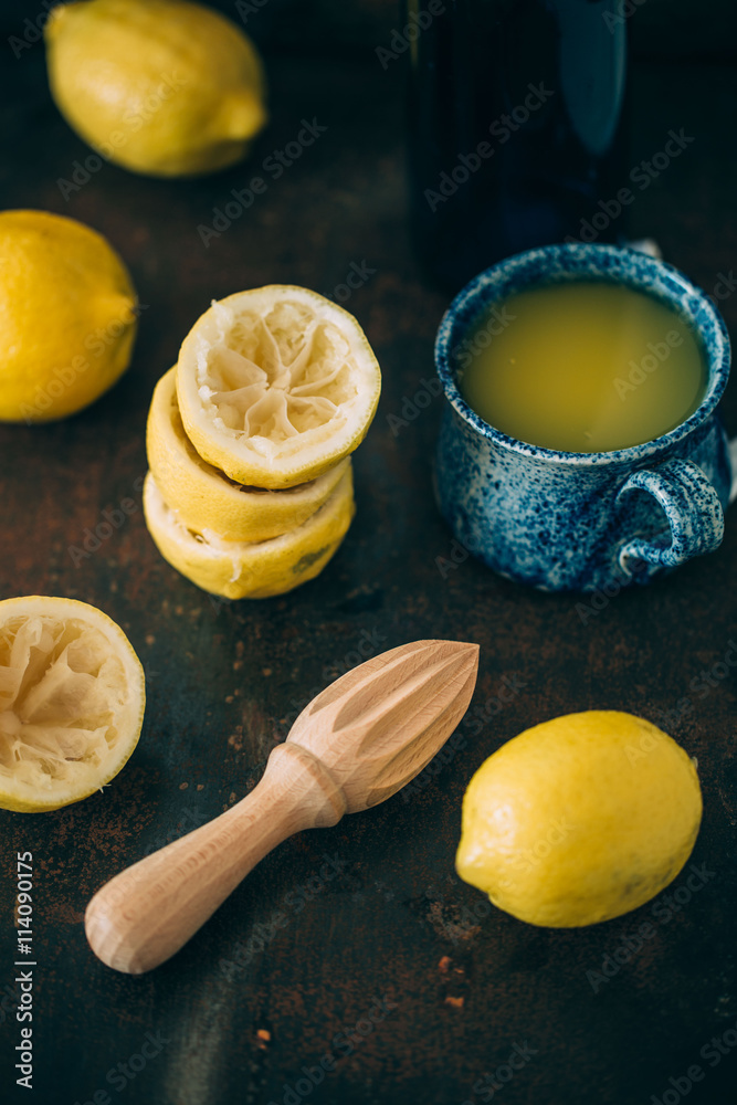 Fresh lemons and juicer. selective focus Fresh lemons and juicer. selective focus
