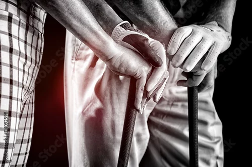 Obraz Złożony wizerunek ręki trzyma kija golfowego