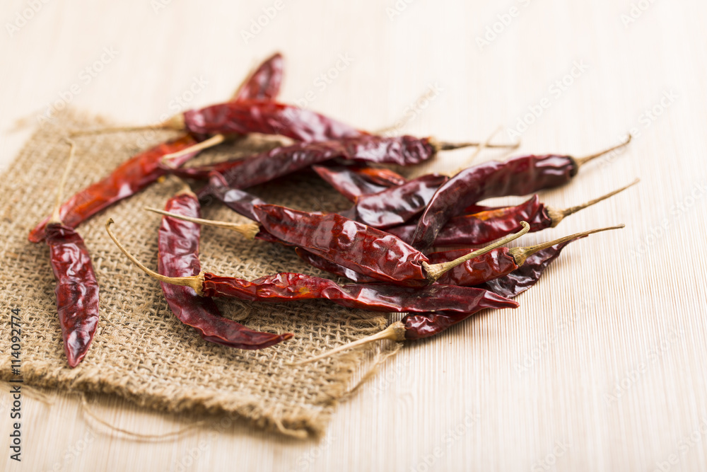 Fototapeta premium Red chilli on wood table