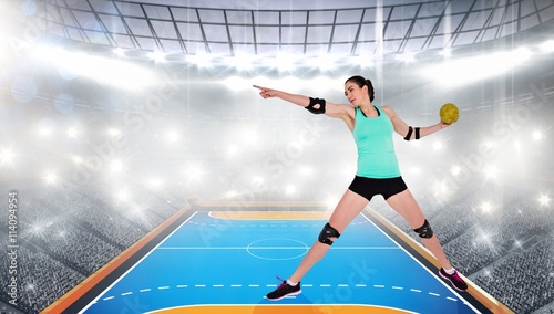 Female athlete with elbow pad throwing handball 