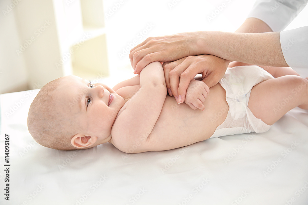 Doctor doing exercises with baby Doctor doing exercises with baby
