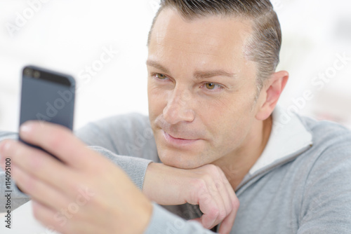 Man reading a text message