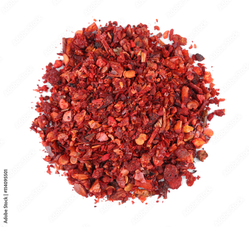 Dried chopped chili pepper isolated on white