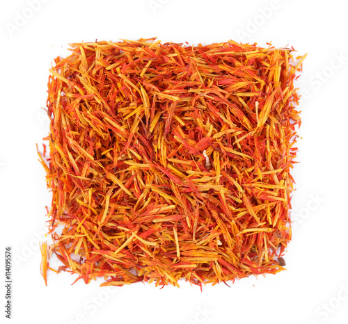 Square of dried saffron on white background